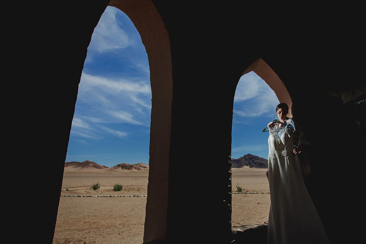 Bride and wedding dress with Namibia Desert in the backround