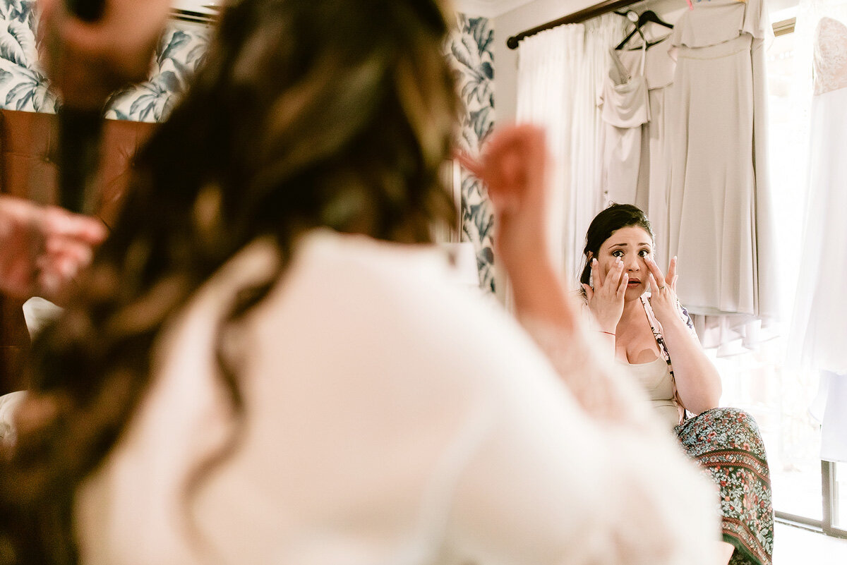 A teary eyed bridesmaid at a wedding in the Northern Cape of South Africa.