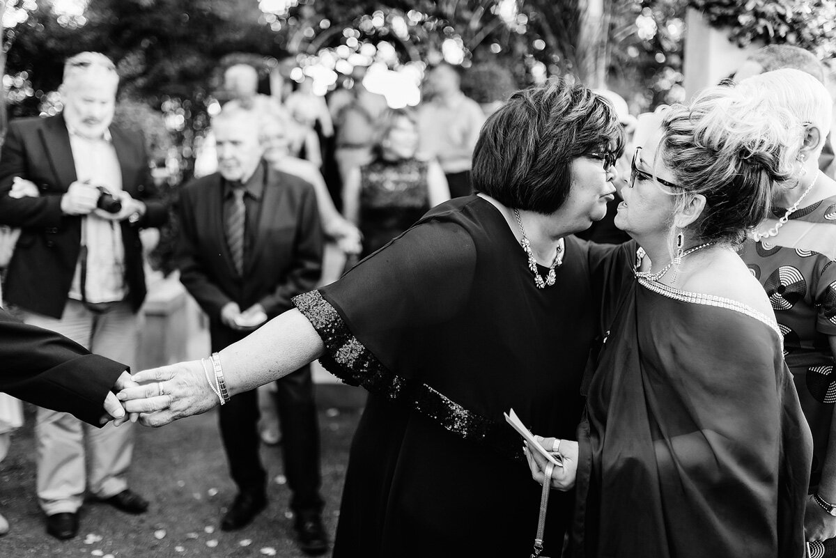 Wedding Moment Kiss between guests at wedding in South AFrica.