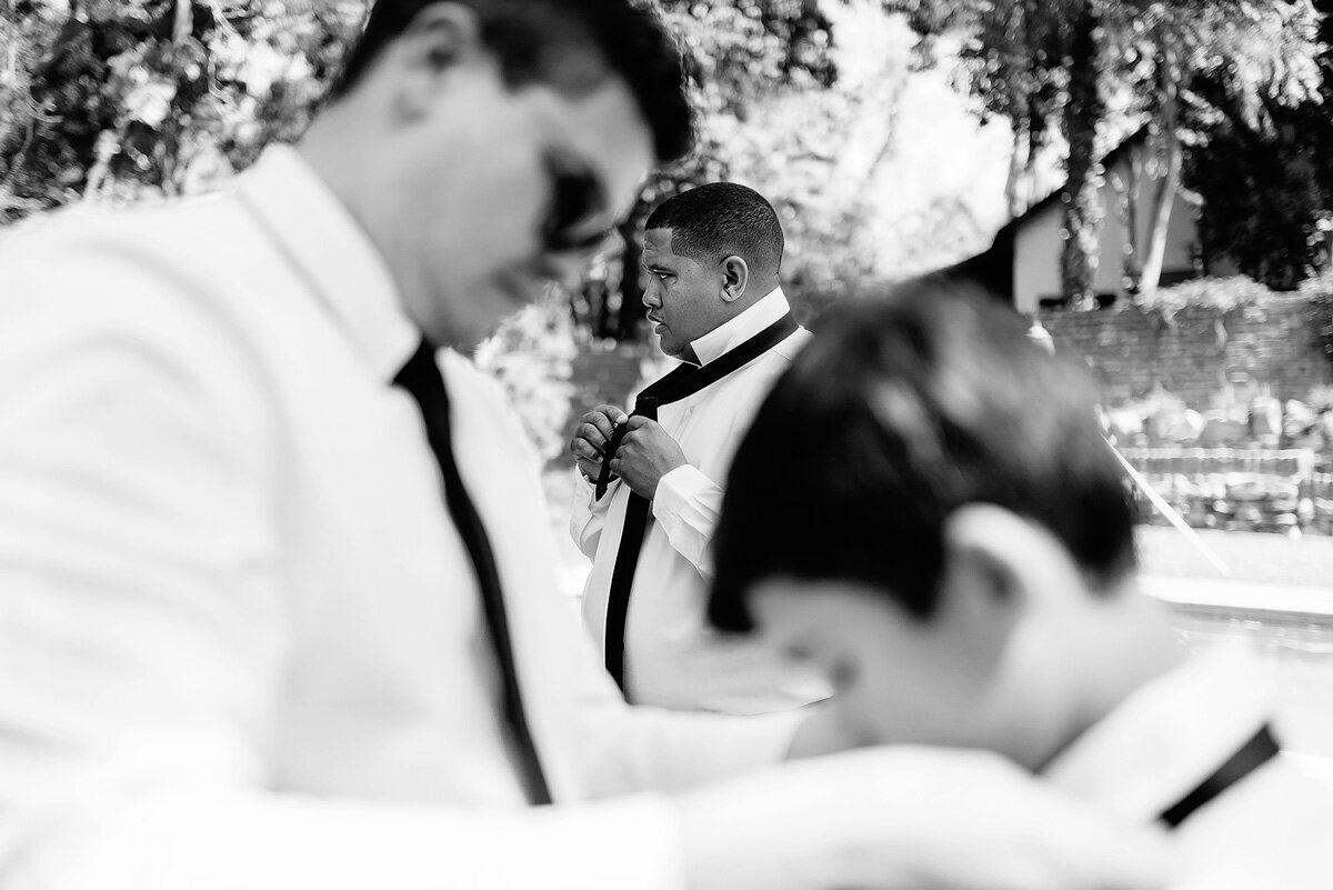 Groomsmen getting dressed before the wedding in the Northern Cape.