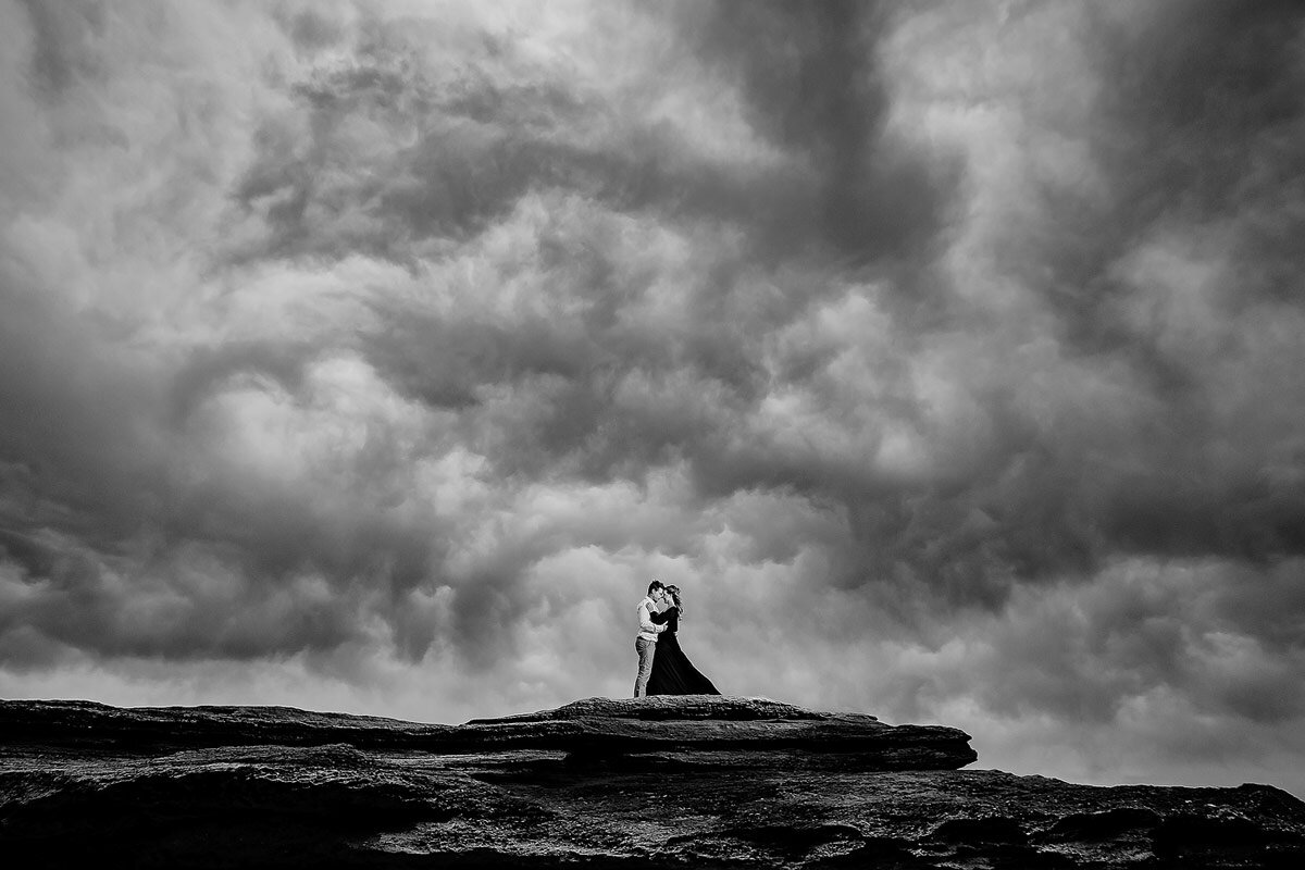 Dramatic Sky with clouds during Engagement Portraits on the beach in the Garden Route.