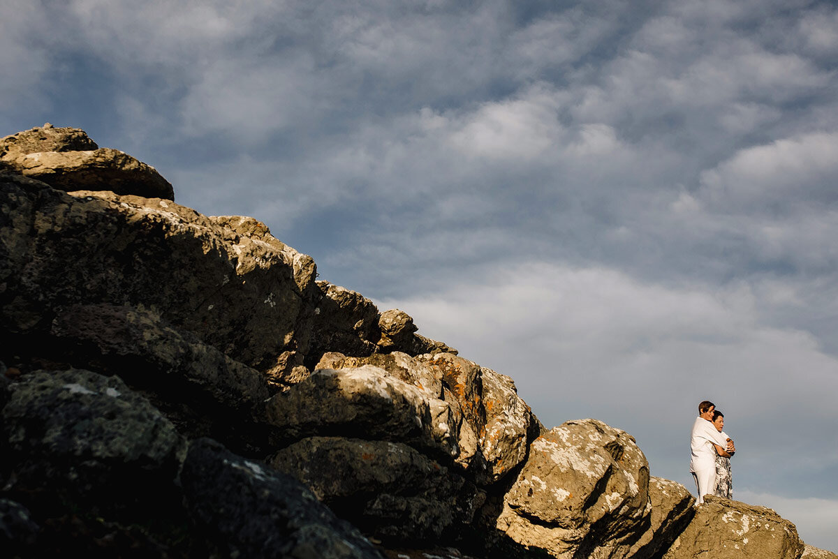 Couple Portraits on a cliff edge at Robberg Nature Reserve in Plettenberg Bay.