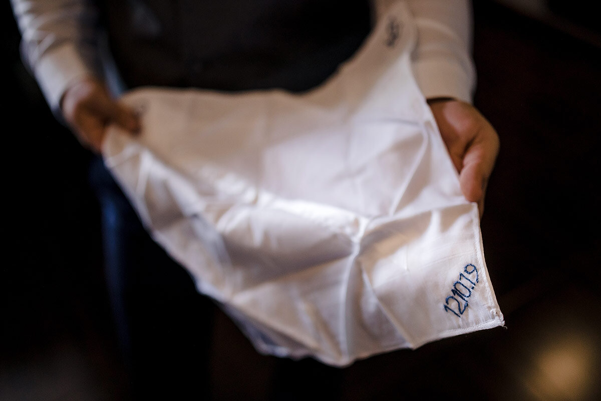 The groom showing off his personal wedding handkerchief at his wedding in Namibia.