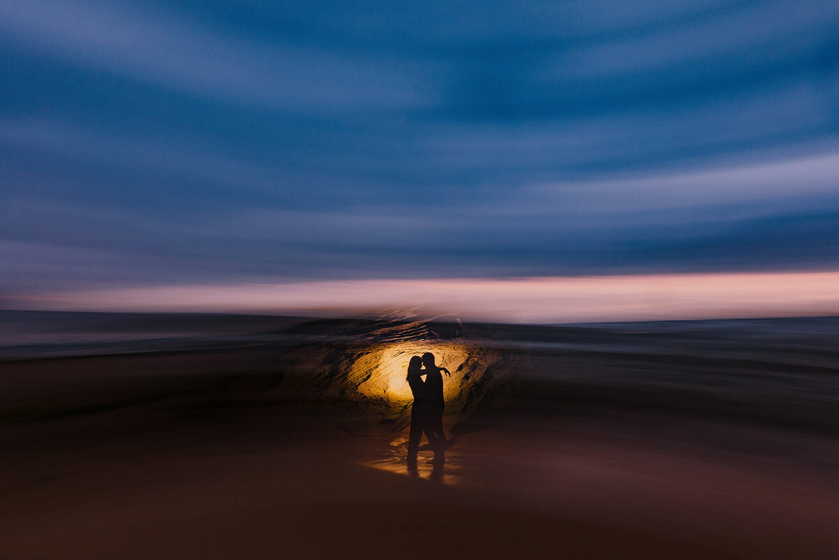 Creative Engagement Couple Photo at Sunset on the beach in the Garden Route.