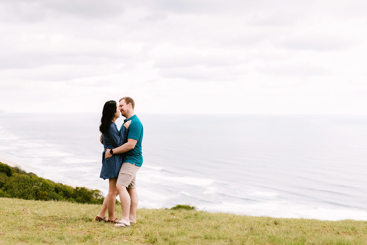 Lifestyle Couple portraits at a paragliding launch location in the Garden Route.