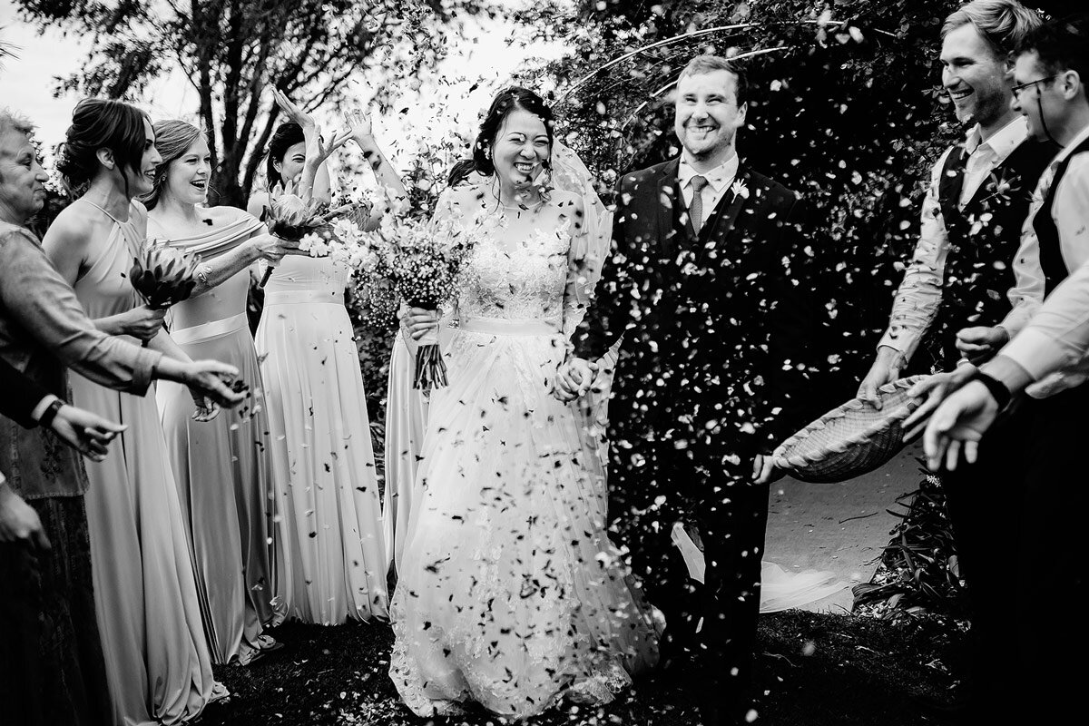 Rose Petal Wedding Confetti while the bride and groom walks between the wedding guests.