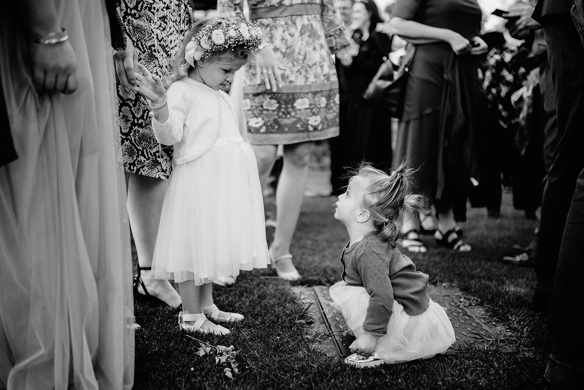 Kids at wedding moment between the flower girls.