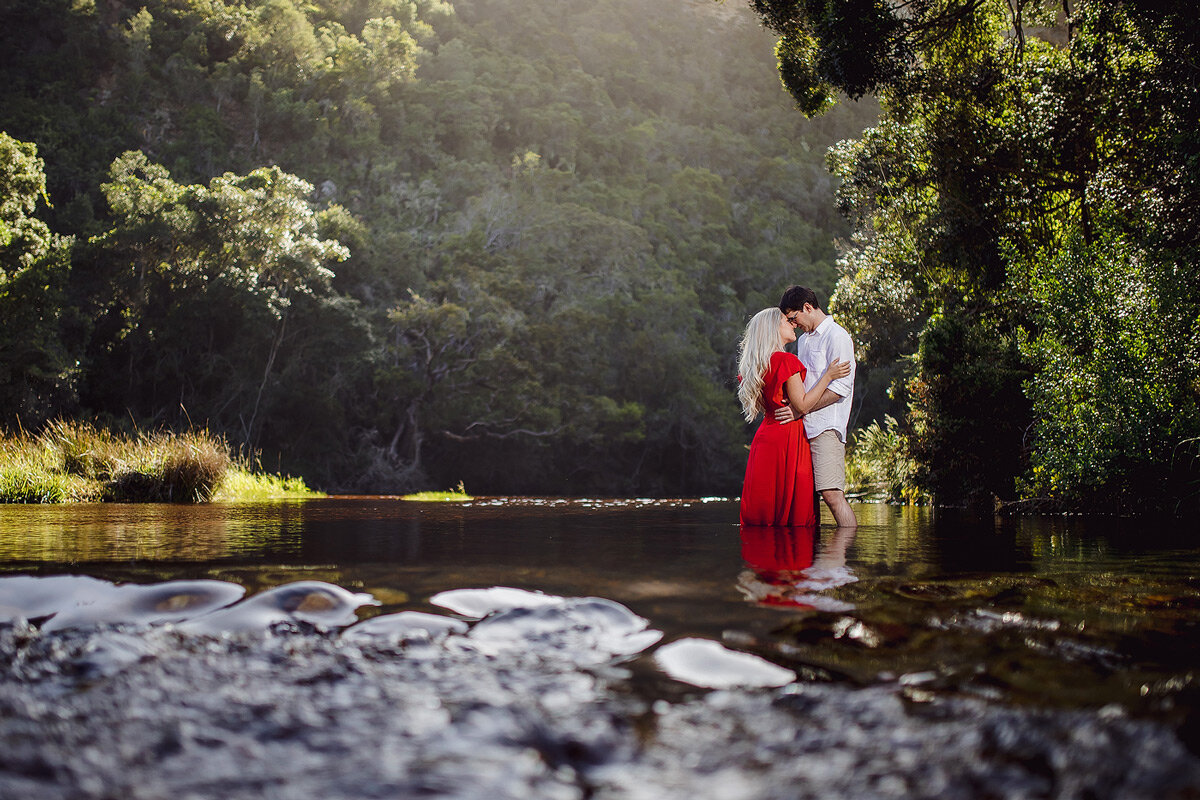 Couple Engagement Portraits in a river in Natures Valley South Africa.