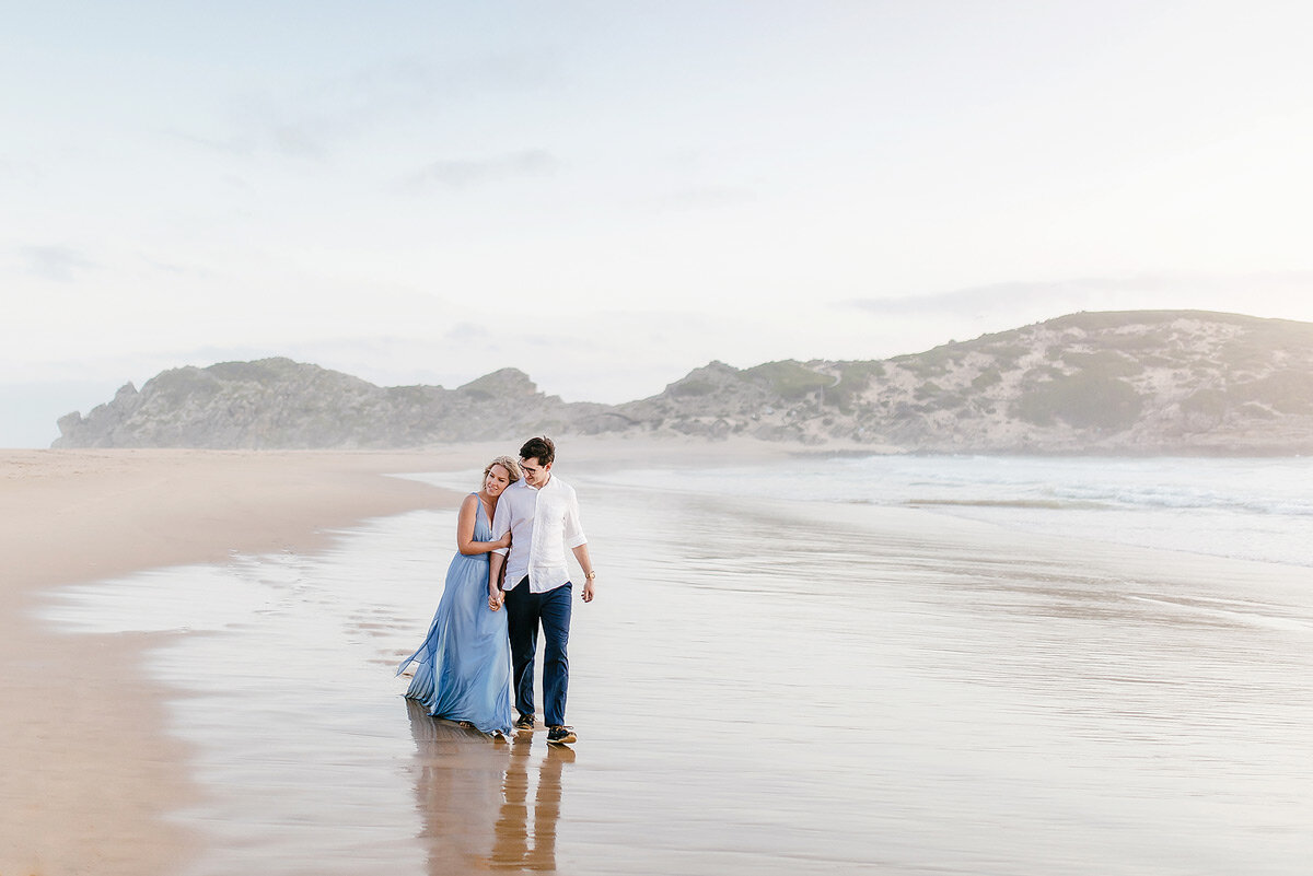 Classic pastel inspired couple portraits on the beach during a destination photo shoot.
