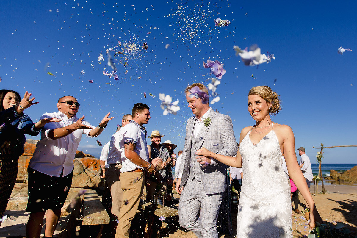 Showers of confetti at the beach wedding ceremony in Plettenberg Bay South Africa