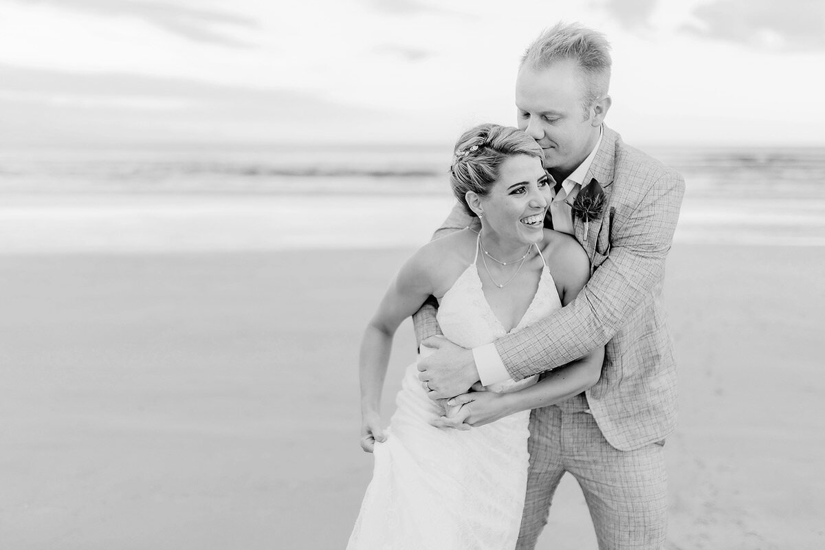 Fun wedding moment between the Groom and Bride on the beach in Plettenberg Bay.