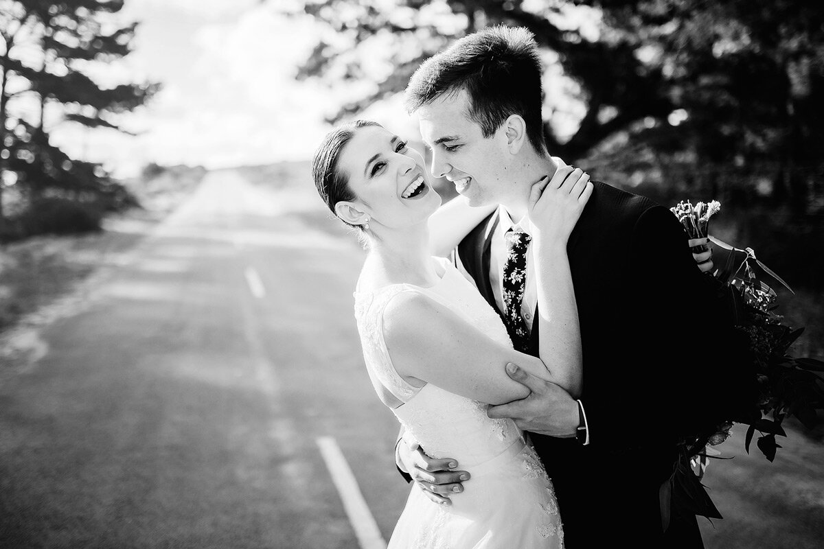Fun laughter wedding couple portraits with bride and groom.