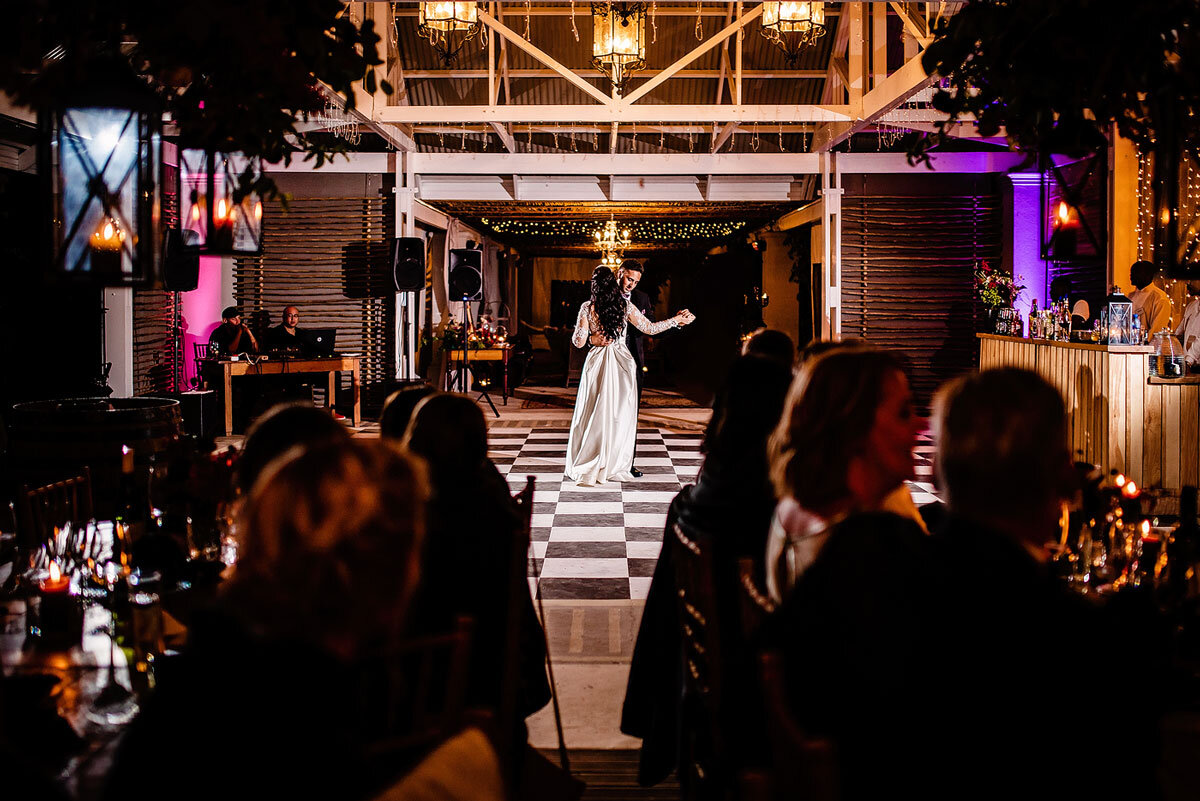 First Dance Moves with checkered dance floor at outdoor wedding venue in the Garden Route.
