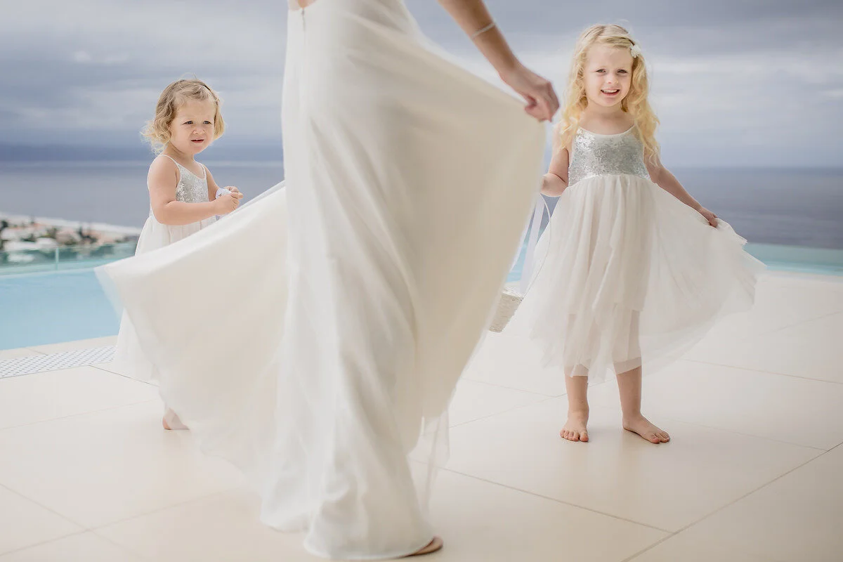 Kids flowergirl dresses flowing the the wind at wedding.