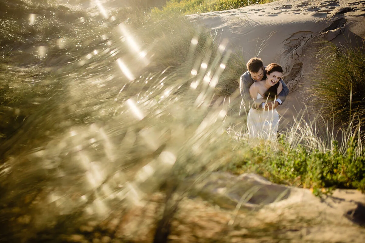 Fun Moments during wedding couple beach portraits.