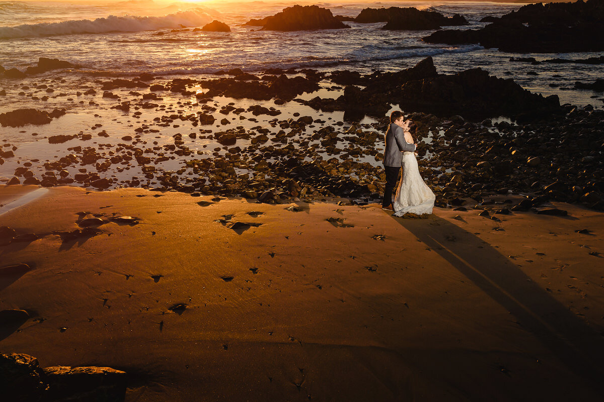 Sunset wedding couple portraits on the beach near Knysna in South Africa.