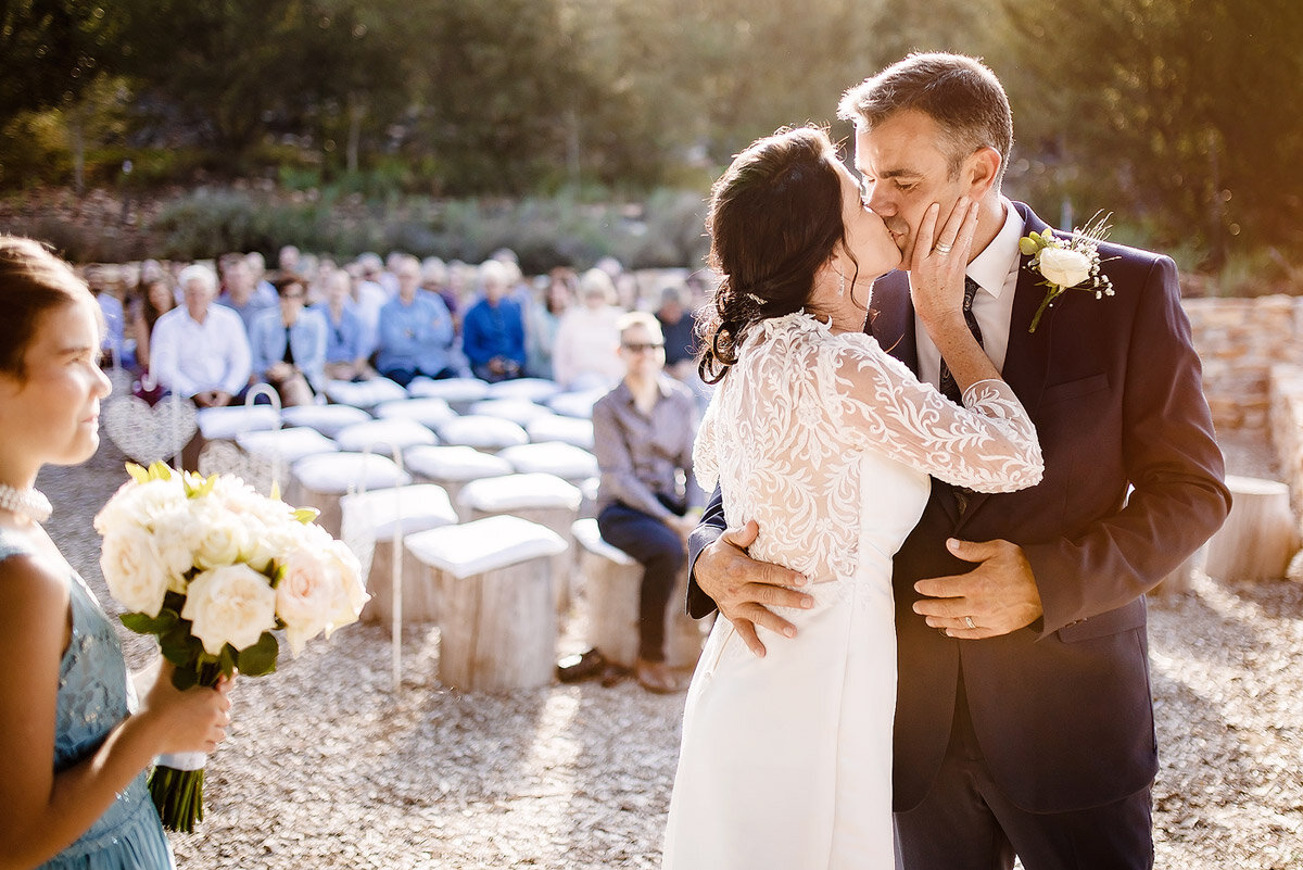 Wedding Kiss at the Outdoor Wedding Ceremony in Waboomskraal South Africa.