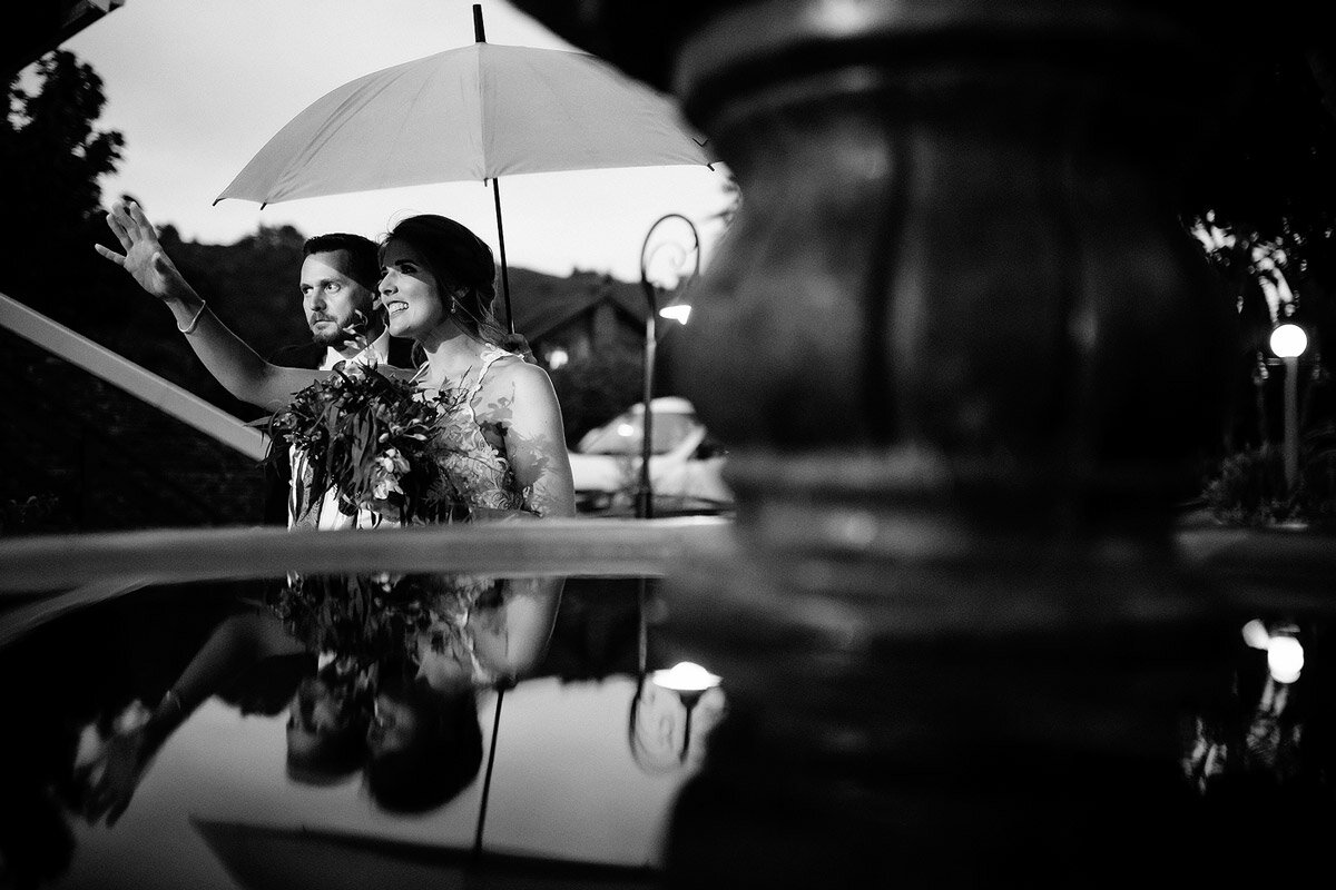 Moment with umbrella before entering the wedding venue in Sedgefield South Africa.
