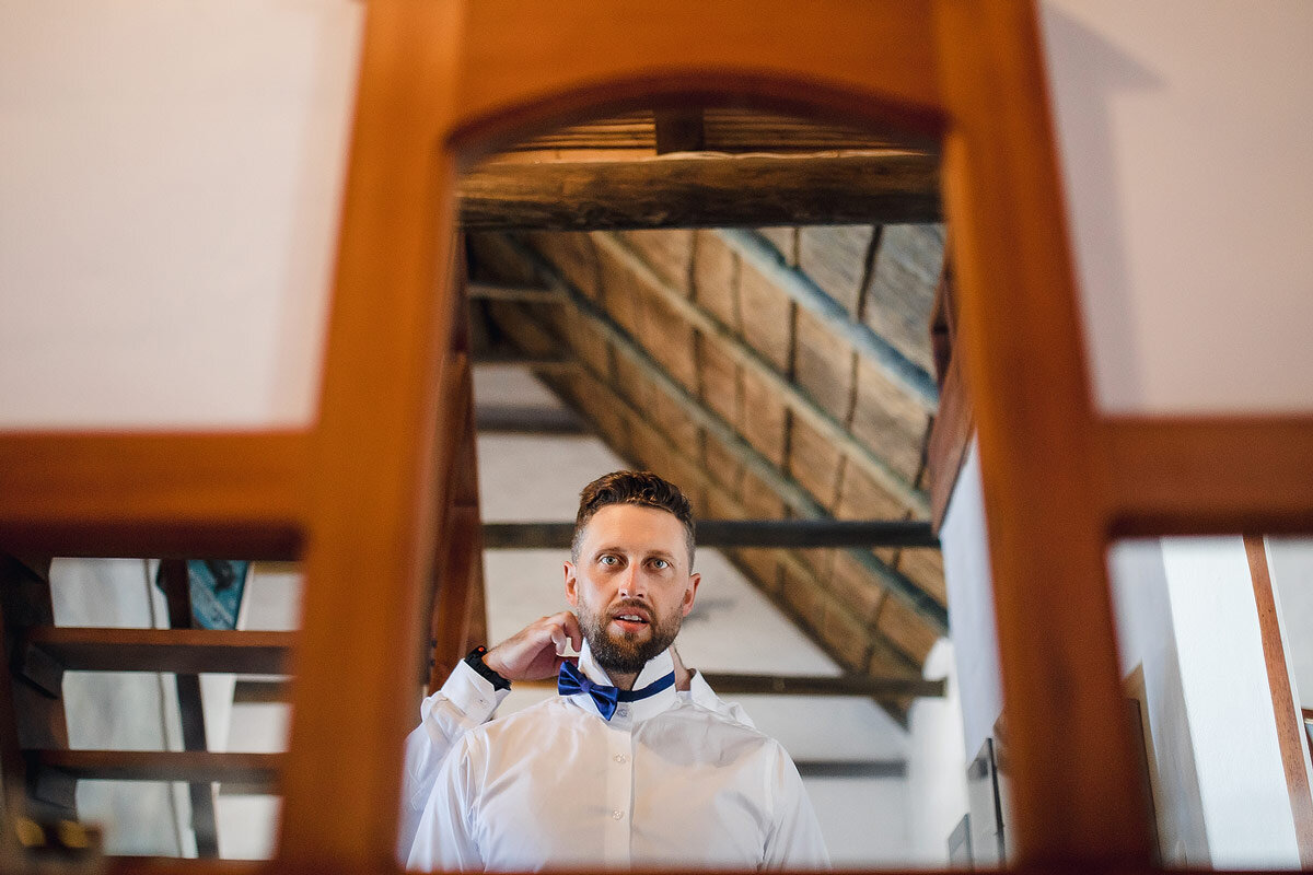 Groom getting dressed before a wedding ceremony in the Garden Route.