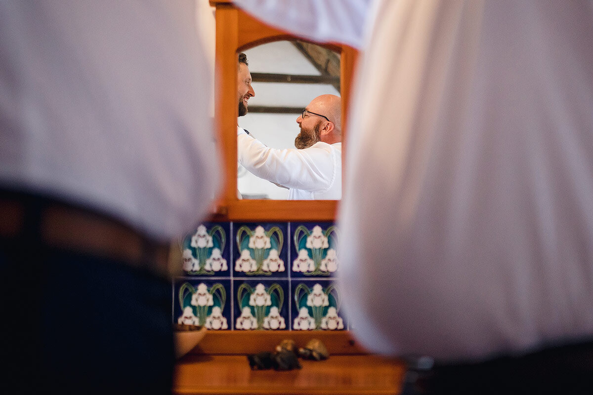 Groom getting dressed before a wedding ceremony in the Garden Route.