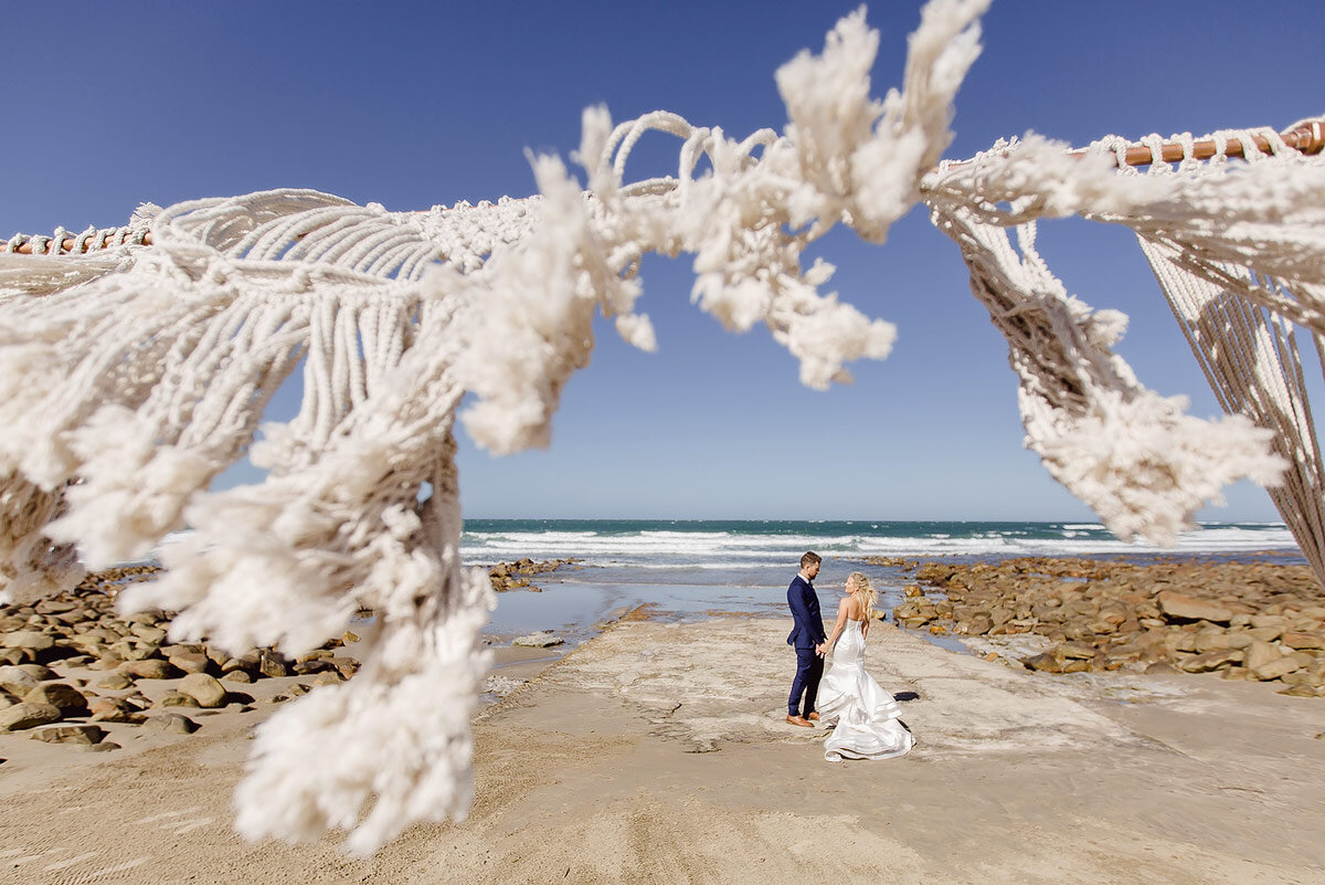 Bride and groom moment on the beach near Mossel Bay in Summer.