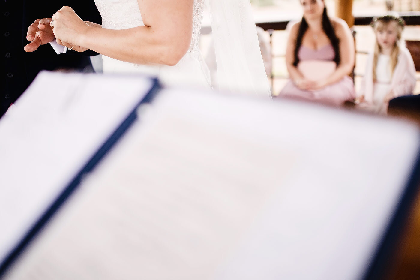 Groom and bride exchange wedding rings.