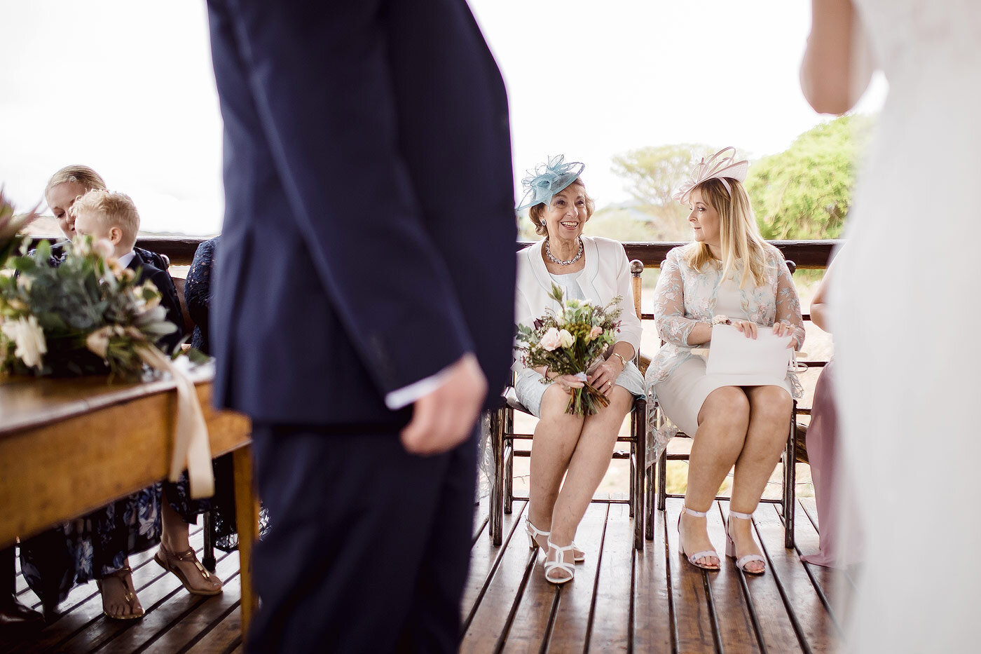 Mother of the bride reacts to a moment in the wedding ceremony.