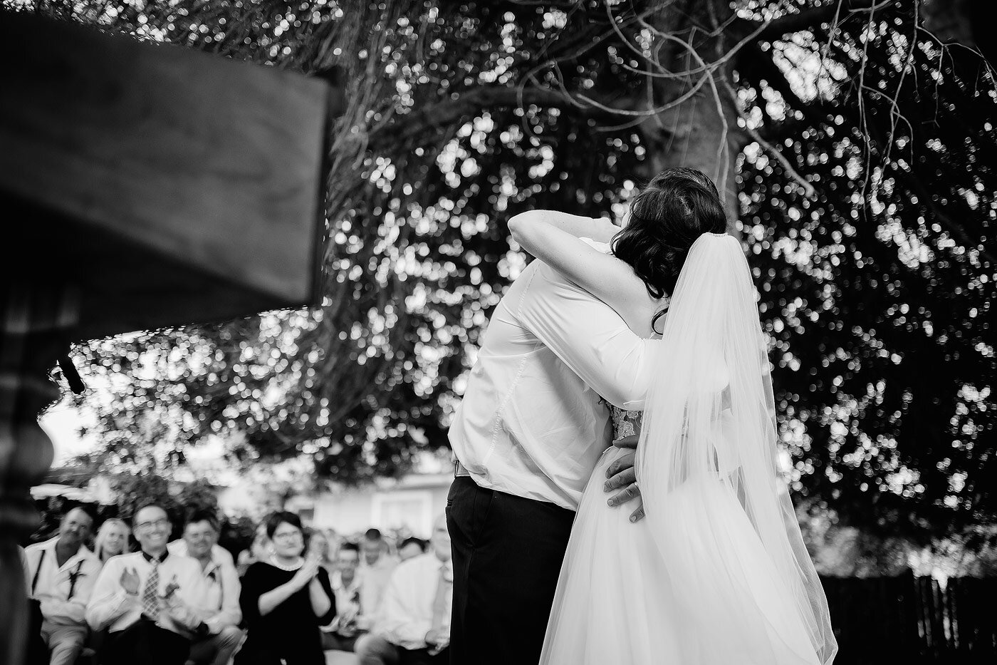 Bride and groom embrace after the wedding ceremony.