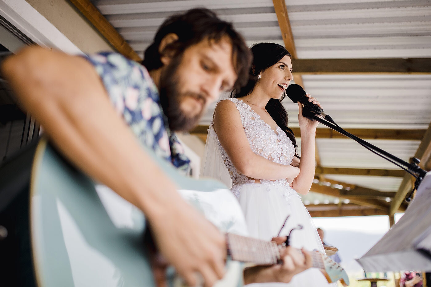 Bride singing for her groom at their wedding.