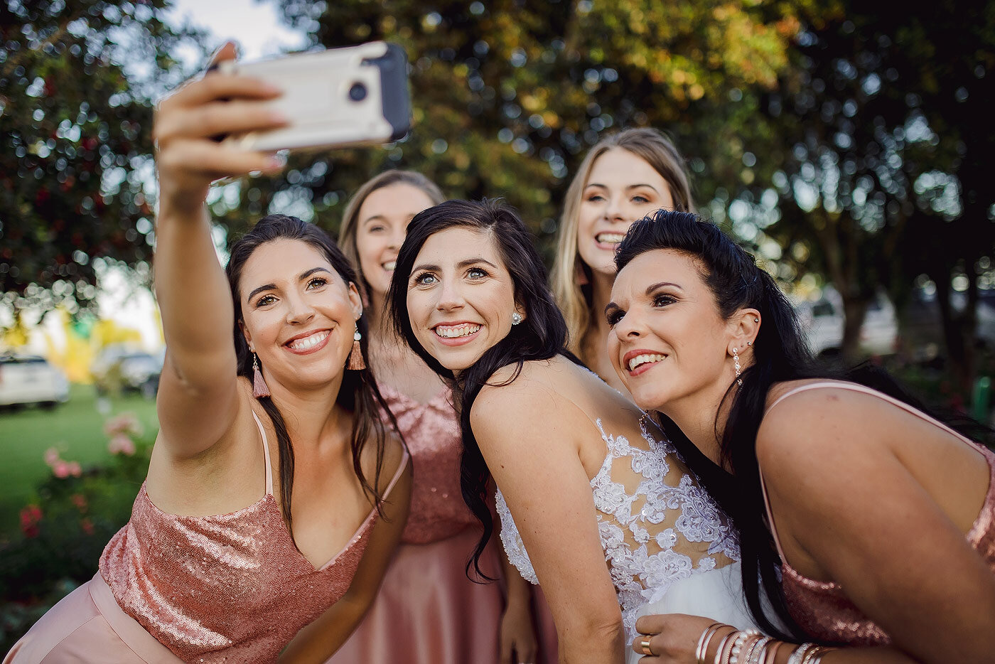 Bride and bridesmaids selfie moment.