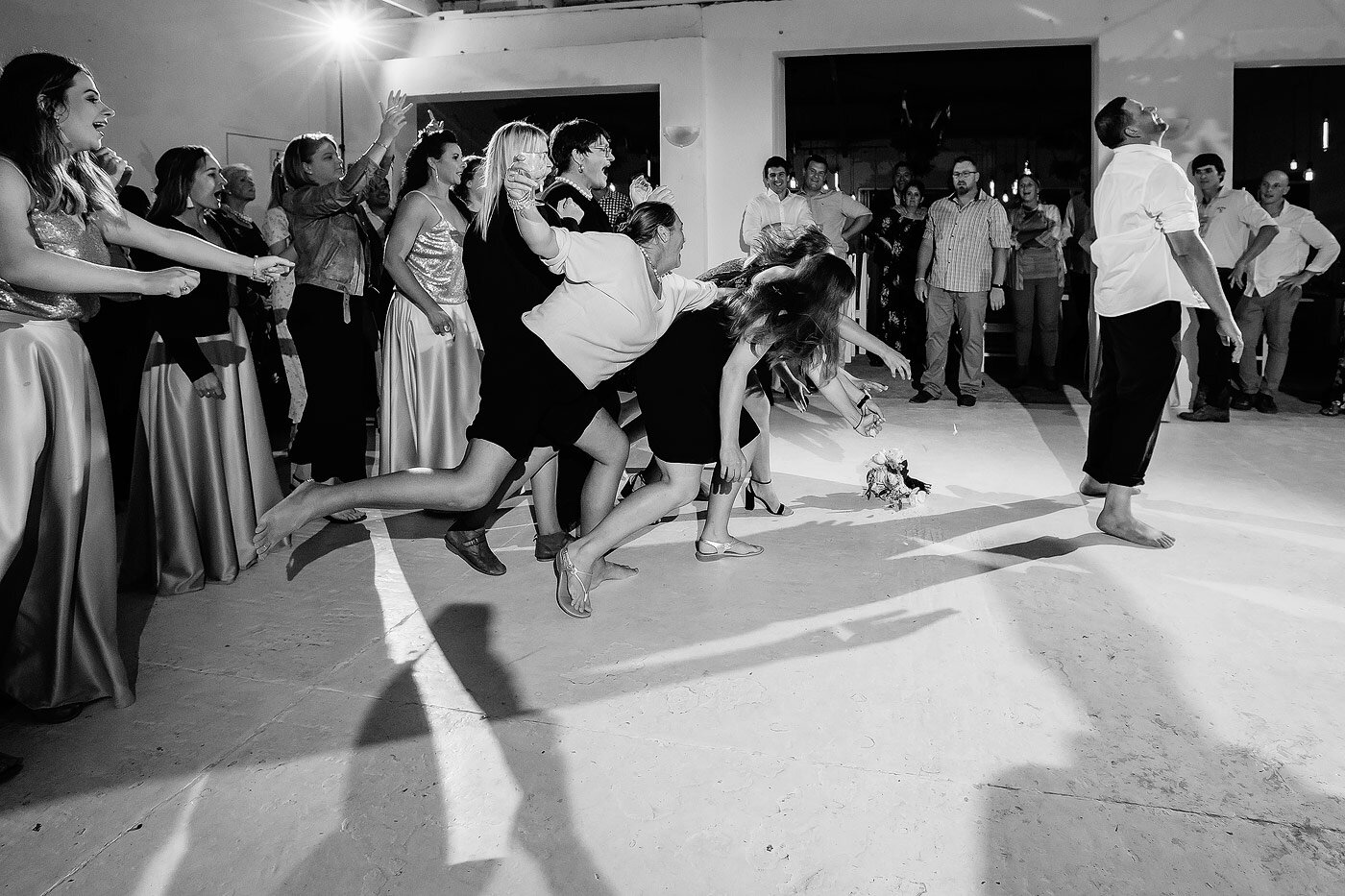 Funny garter toss moment at the Garden Route wedding.