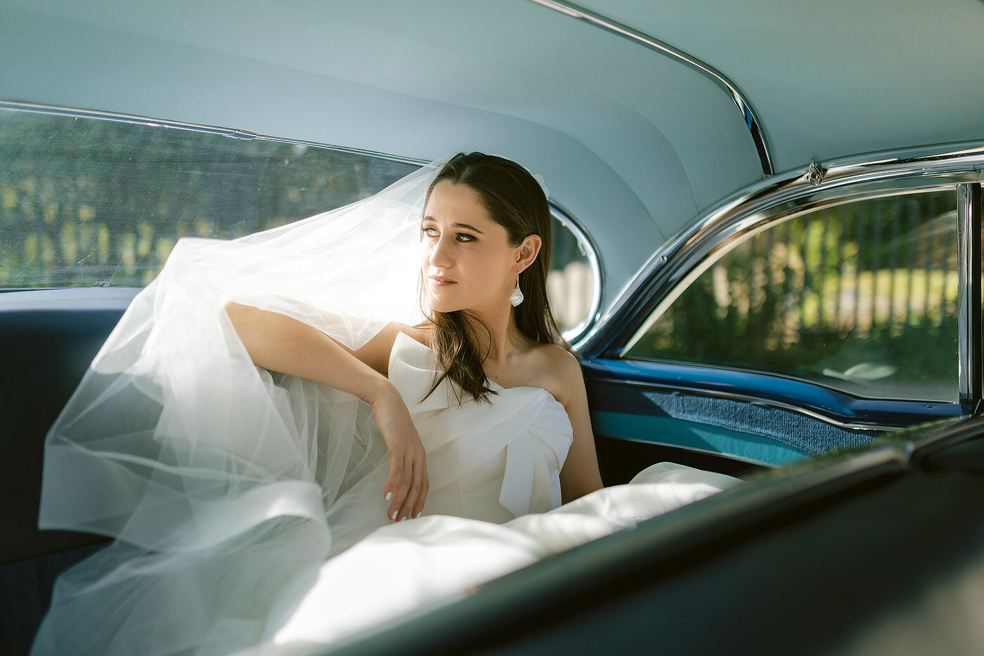 Soft and elegant Bridal portraits in a vintage car Plettenberg Bay.