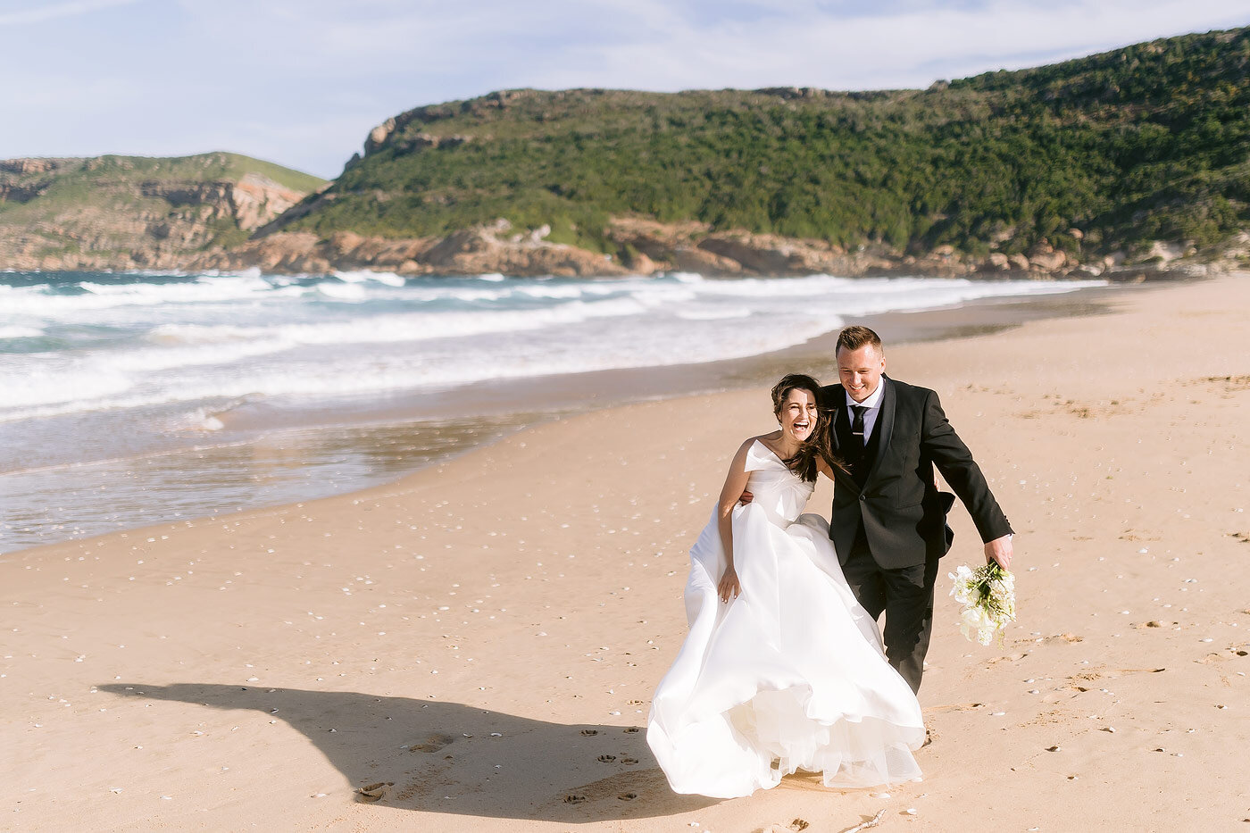 Wedding Couple portraits on the beach with Robberg in the backround.