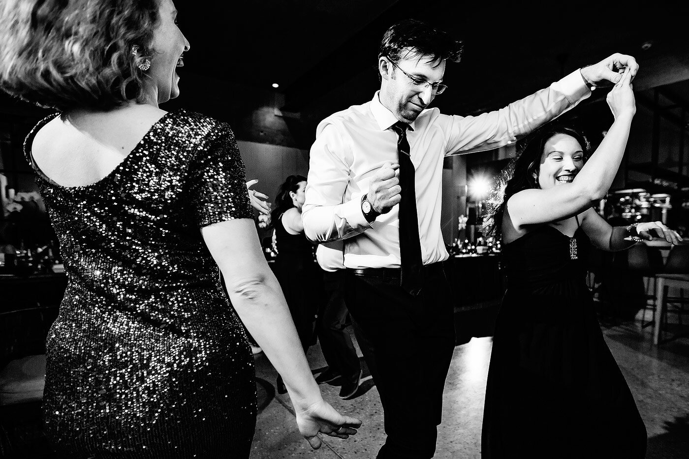Guests dancing with laughter during a Garden Route wedding.