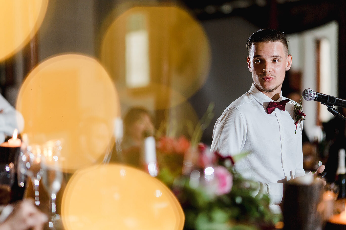 Wedding speech with light bokeh in the foreground