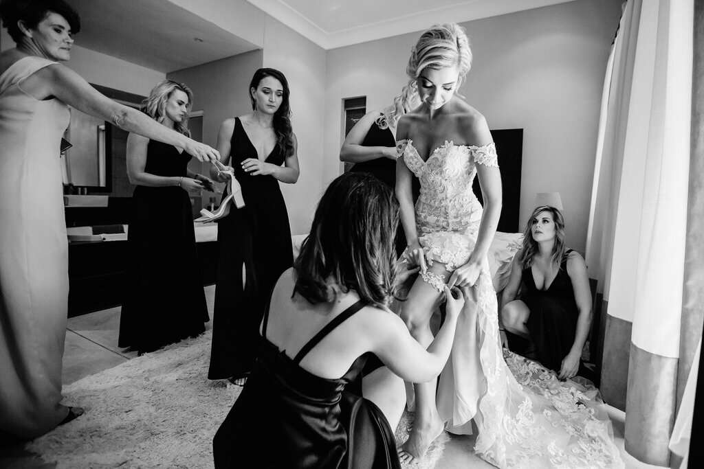 Bride Getting Dressed with bridesmaids