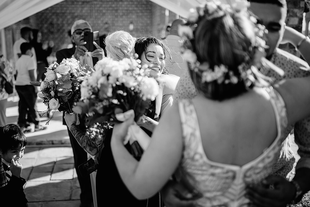 Hugs and kisses after wedding ceremony