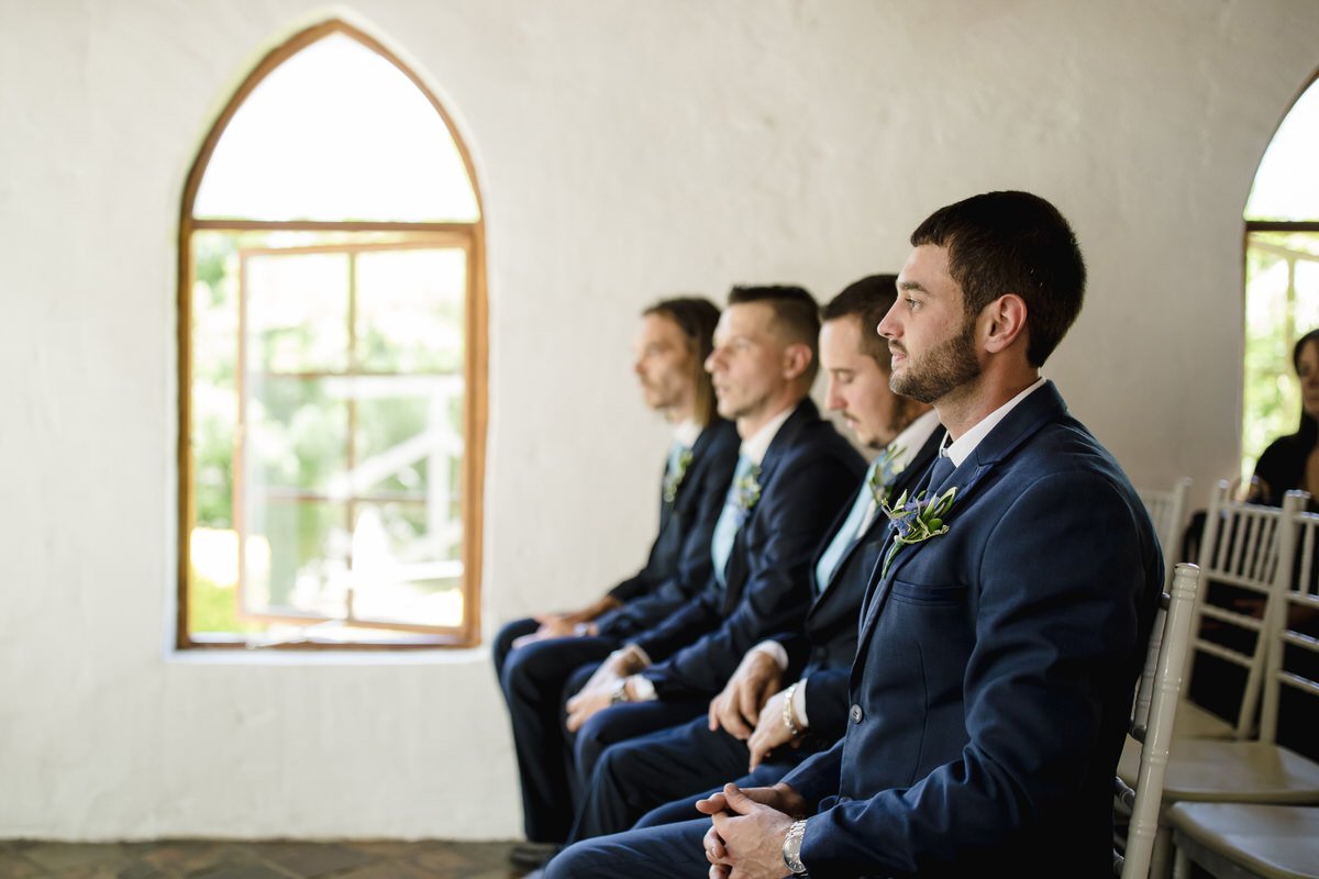 Groom waiting for the bride at wedding Chapel