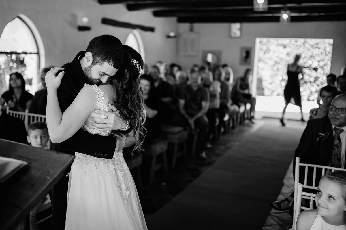 Bride and Groom Kiss during Wedding Ceremony