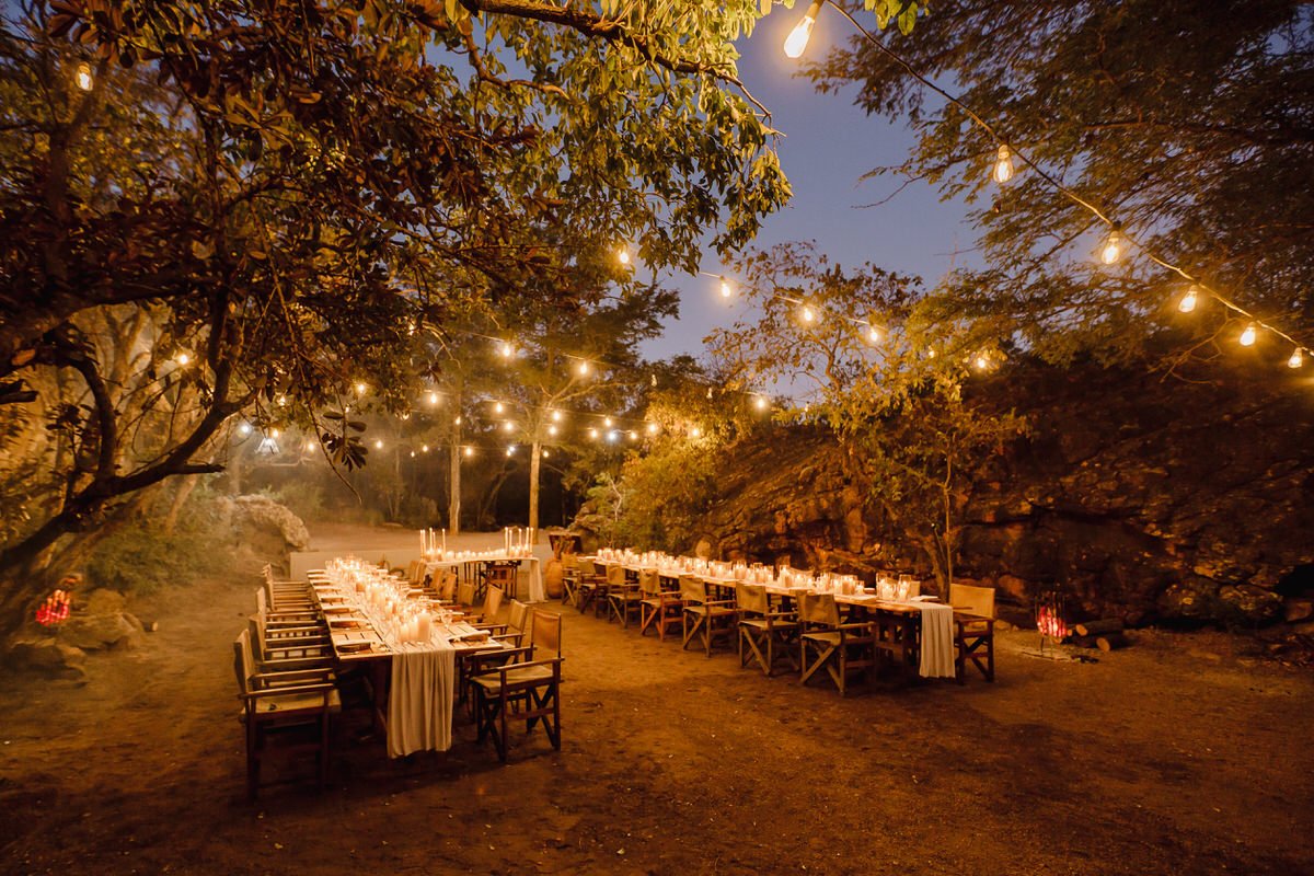 Wedding couple portraits with the bride and groom in a candle lit wedding reception venue.