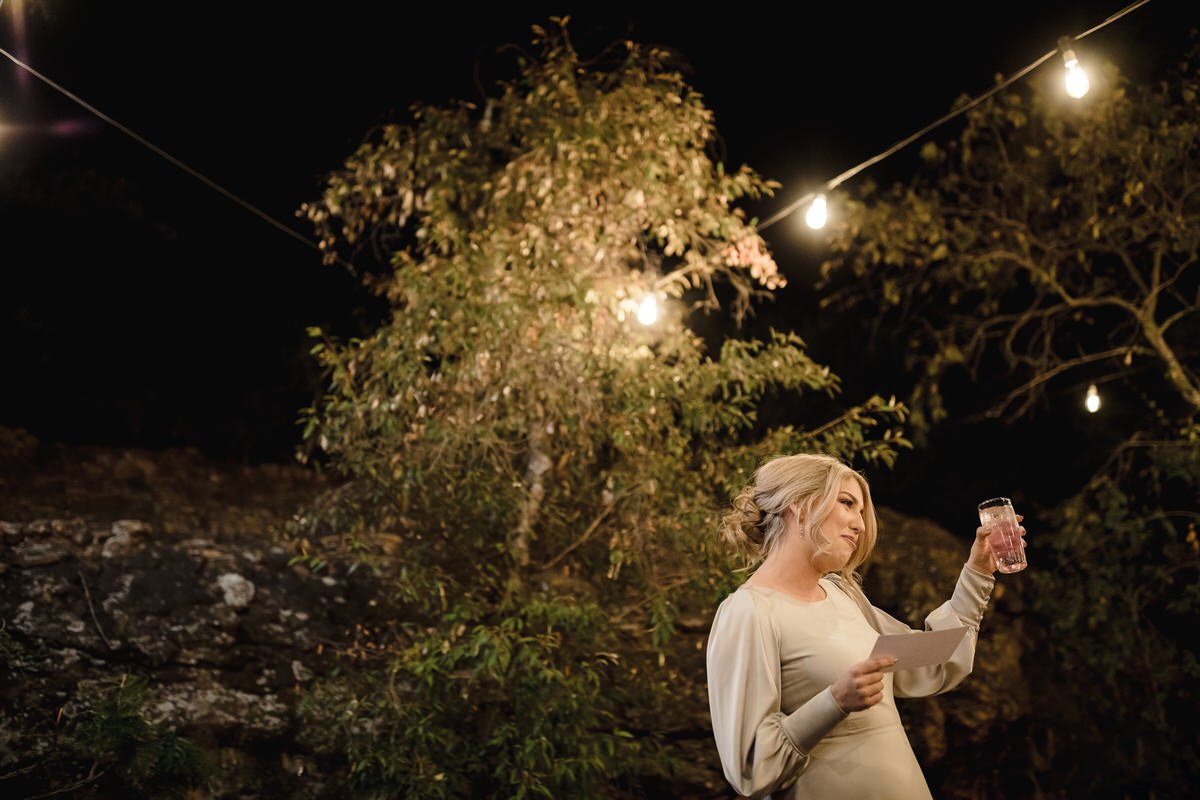 Wedding reception and toasts in a candle lit wedding reception venue.