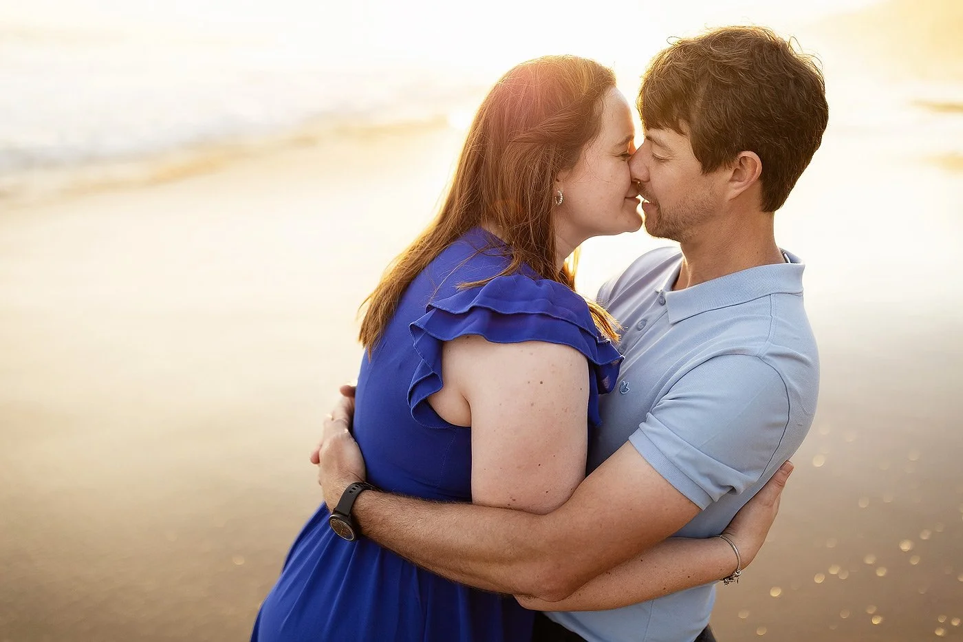 Couple Kissing at Sunset on the beach in WIlderness