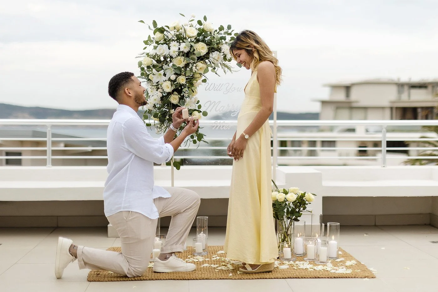 Guy asking his girlfriend to marry him.