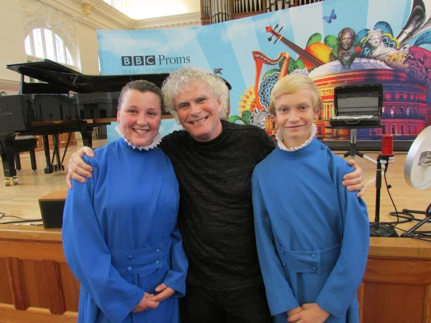 The Head Girl and Boy Choristers with Sir Simon Rattle OM at the BBC Proms.