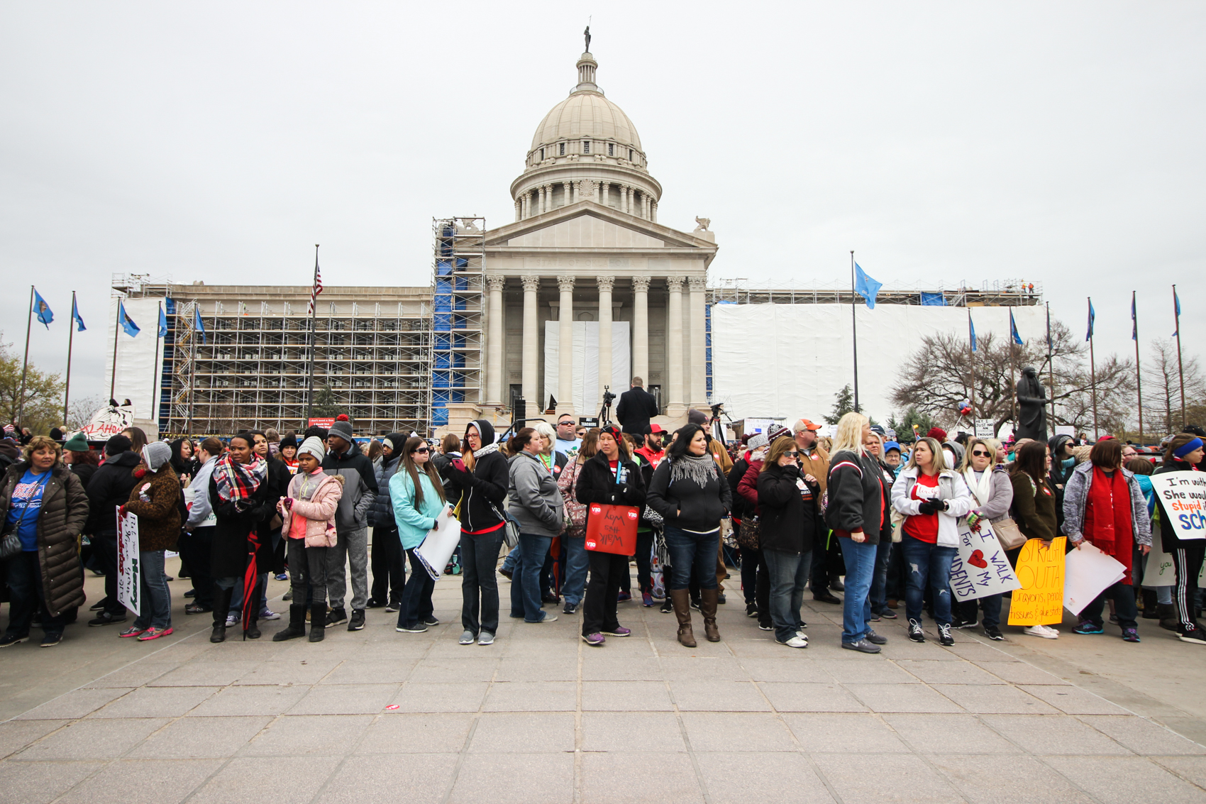 Demonstrators march around the Oklahoma State Capitol.