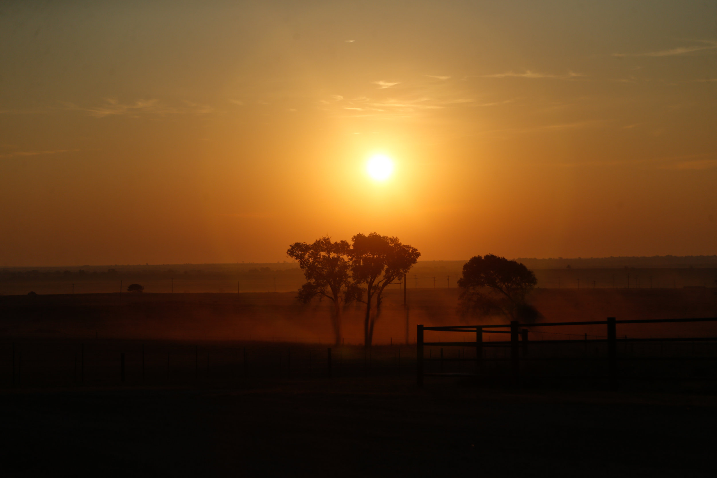 The sun rises over the Stierwalt Ranch in Burbank, Oklahoma on July 27, 2019.