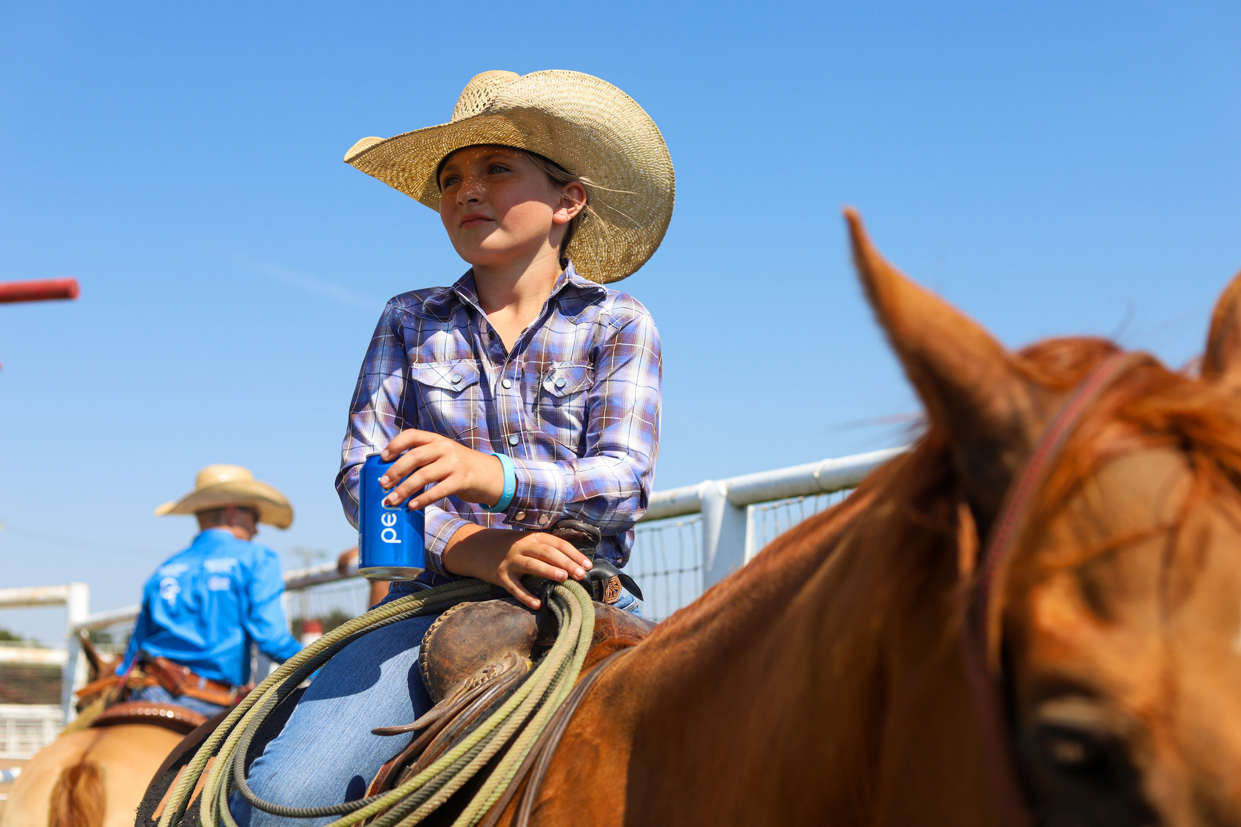 10-year-old Rowdy Stierwalt waits for her first event during the youth ranch rodeo at the 101 Arena in Ponca City, Oklahoma.