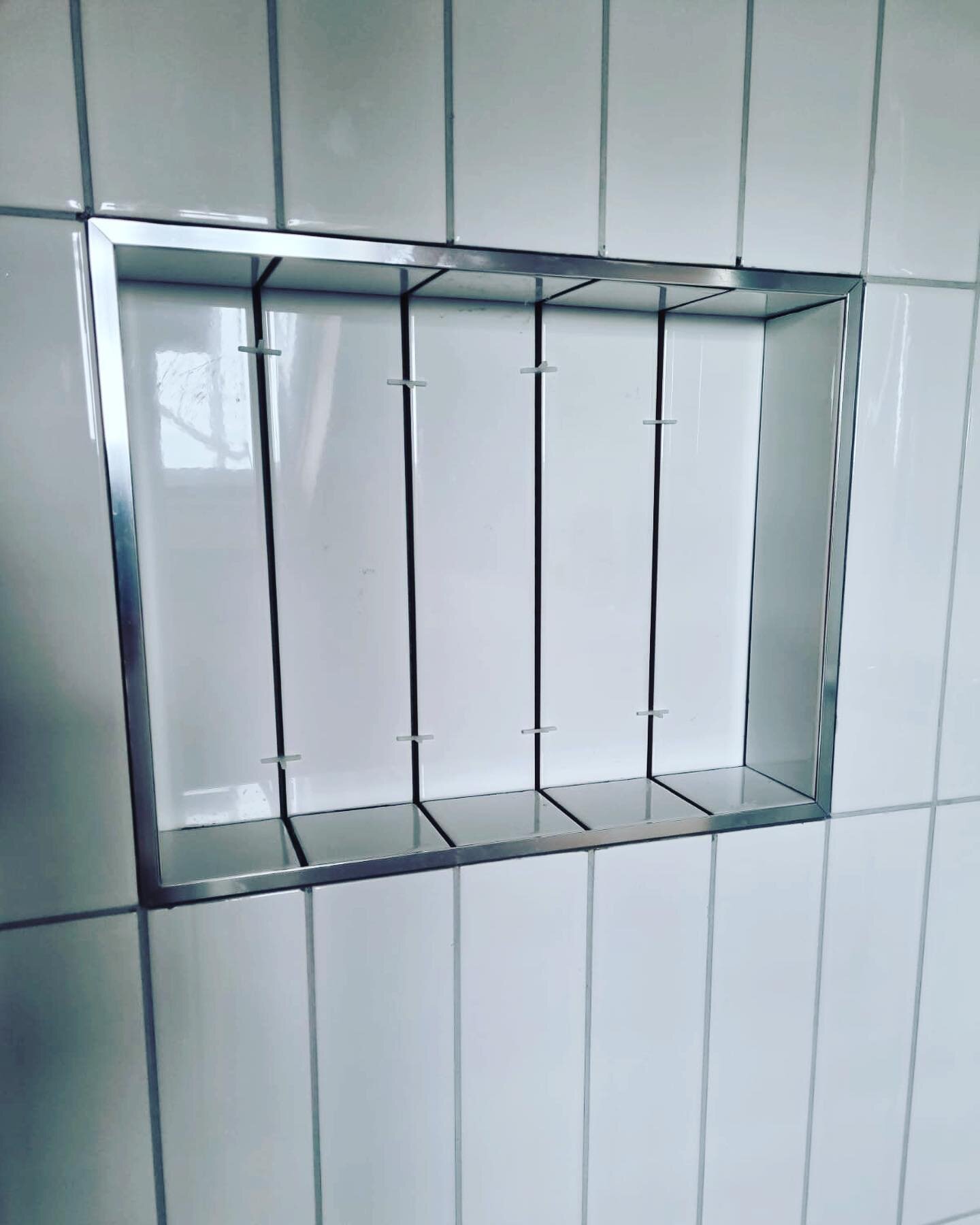 Storage shelf in bathroom, love putting these into peoples bathrooms for all their bottles! #storage #bathroom #tiling #tiles #bottles #plastering #builder #carpentry #carpenter #bromley #beckenham #chislehurst #renovation #inspiration