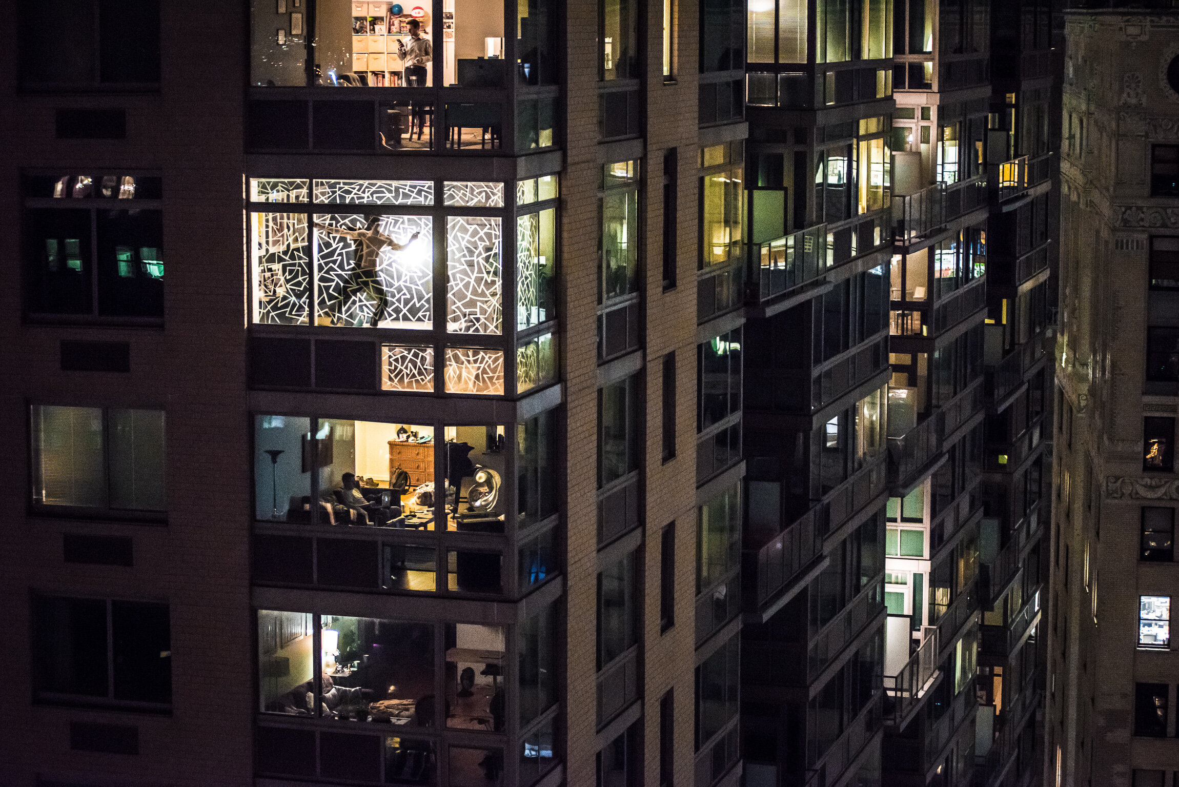 Marco Painting Windows Across Street (Photo by Pasha Kalachev).jpg