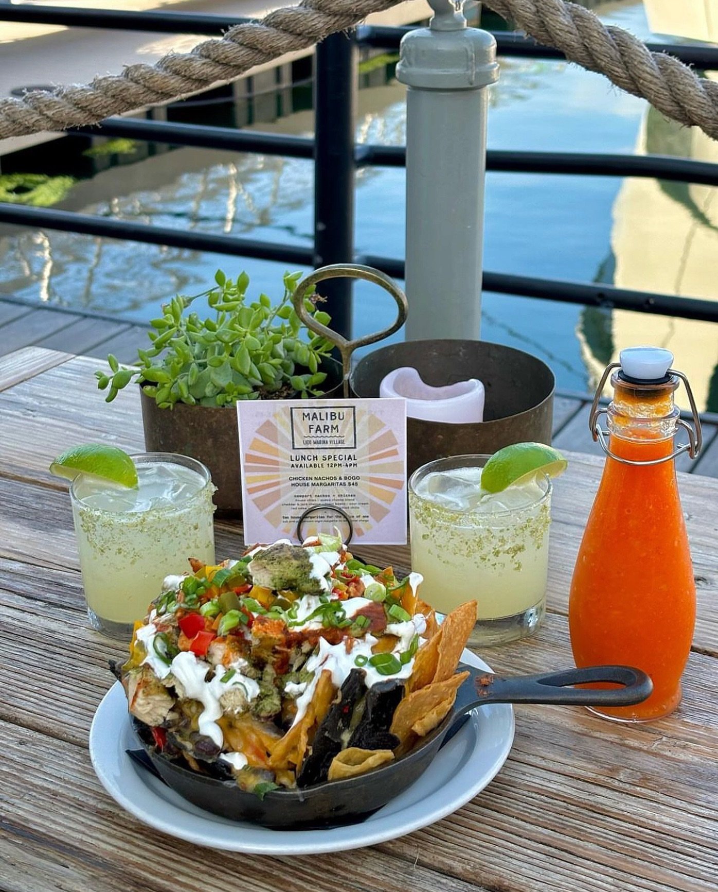 Scoop up Newport Nachos Lunch Special from @malibufarmlido and enjoy two margaritas for the price of one! #LidoMarinaVillage
